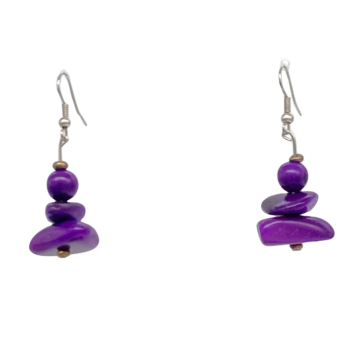 Dangle earring composed of an irregular shaped piece of Tagua nut, a bead of coconut shell, and a tiny bead of acai berry