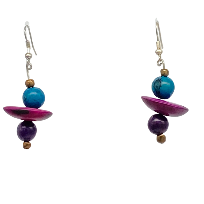 Dangle earring composed of an irregular shaped piece of Tagua nut, a bead of coconut shell, and a tiny bead of acai berry