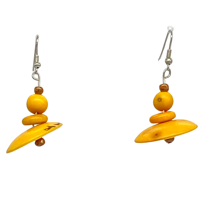 Dangle earring composed of an irregular shaped piece of Tagua nut, a bead of coconut shell, and a tiny bead of acai berry