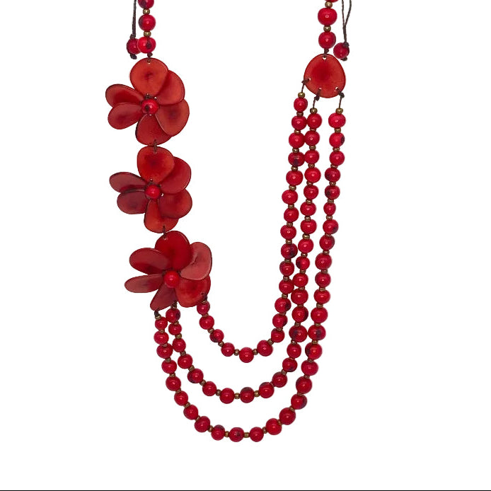 Red beaded necklace with red flower-shaped beads on a white background