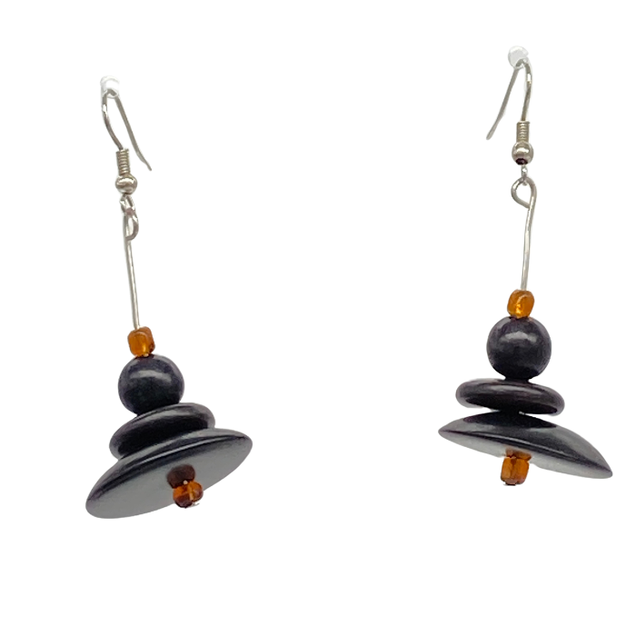 Dangle earring composed of an irregular shaped piece of Tagua nut, a bead of coconut shell, and a tiny bead of acai berry